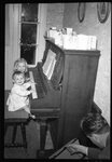 Children Playing Piano by Fred A. Blocker