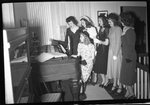 Women Singing and Playing Piano by Fred A. Blocker