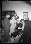 People Singing and Playing Piano by Fred A. Blocker