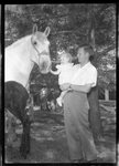 Professor and Daughter with Horse by Fred A. Blocker