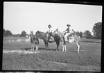 Couple on Horses with Foal by Fred A. Blocker