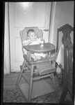 Baby in High Chair by Fred A. Blocker