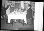 People at Dining Table by Fred A. Blocker