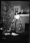 Woman by Christmas Tree by Fred A. Blocker