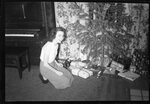 Woman by Christmas Tree by Fred A. Blocker