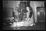 Woman Seated by Christmas Tree by Fred A. Blocker