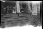 Child and Puppy on Porch by Fred A. Blocker