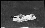 Infant Lying Outdoors by Fred A. Blocker