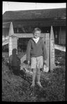 Boy Posing in front of House by Fred A. Blocker