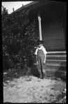 Boy in Costume Posing in front of House by Fred A. Blocker