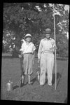 Man and Boy Posing with Hunting and Fishing Gear by Fred A. Blocker