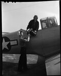 Men Loading Plane with Large Camera by Fred A. Blocker