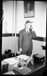 Man Talking on the Phone in Office by Fred A. Blocker
