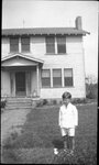 Boy in front of House by Fred A. Blocker