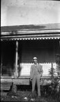 Man in front of House by Fred A. Blocker