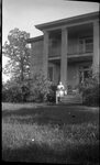Woman in front of House by Fred A. Blocker