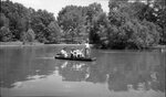 People in Boat in Pond by Fred A. Blocker