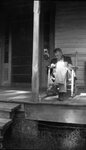 Man Sitting on Porch by Fred A. Blocker