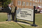 Vance Watson, Jo Ann Watson, and new building sign
