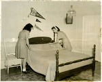 4-H Members making bed