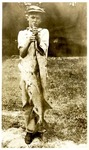 Young Boy with Paddlefish
